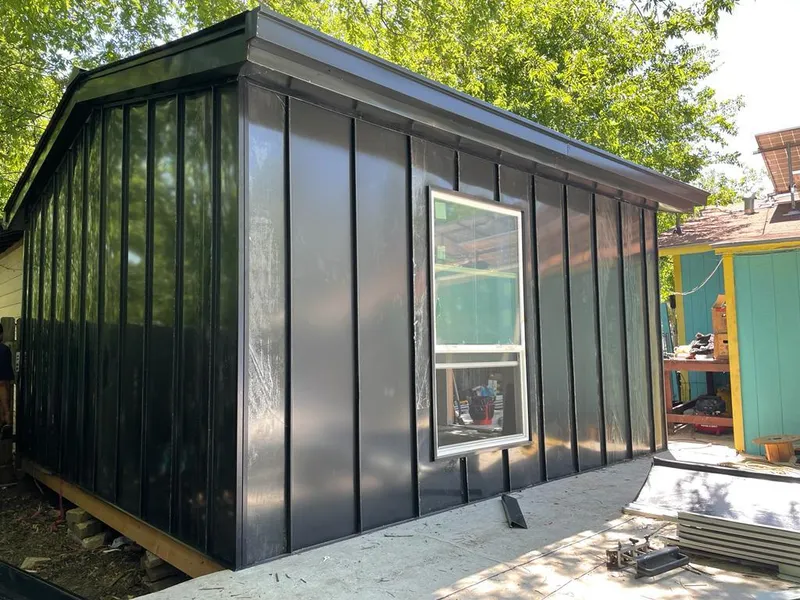 Black standing seam metal wall panels for Metal Roof Installation in Ghent